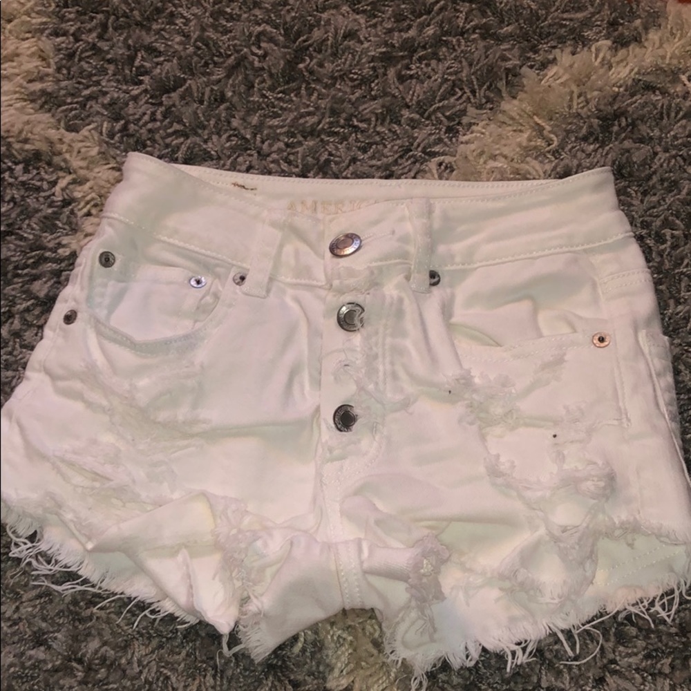 Ripped white shorts